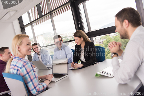 Image of Business Team At A Meeting at modern office building