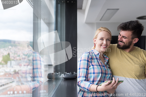 Image of Business People Working With Tablet in startup office