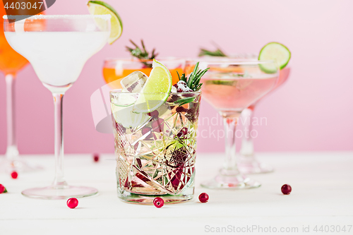 Image of The rose exotic cocktails and fruits on pink