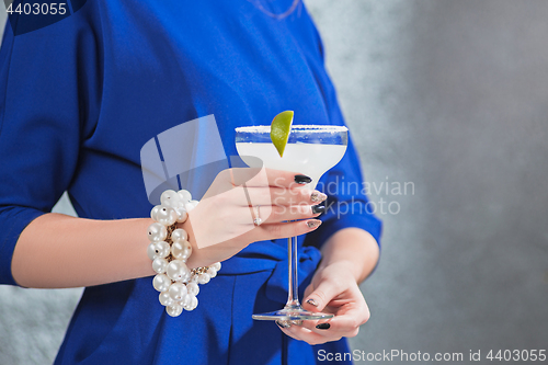 Image of The exotic cocktail and female hands