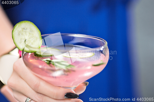 Image of The exotic cocktail and female hands