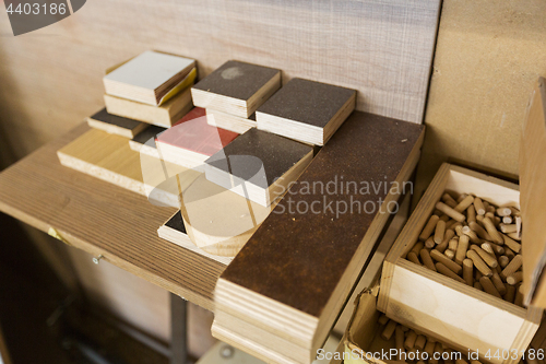 Image of wood dowel pins and board samples at workshop