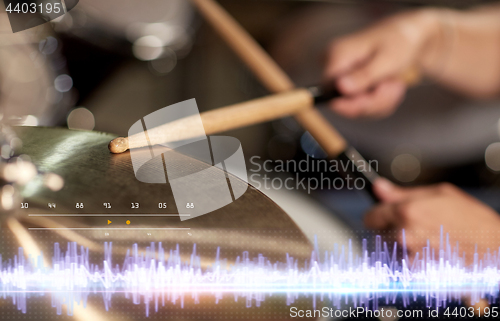 Image of drummer playing drum kit at sound recording studio