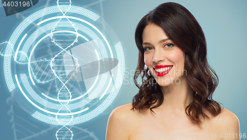 Image of woman with red lipstick over dna molecule