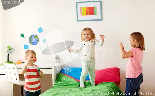 Image of kids blowing soap bubbles and playing at home