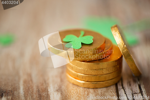 Image of gold coins with shamrock on wooden table