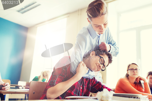 Image of student boy suffering of classmate mockery