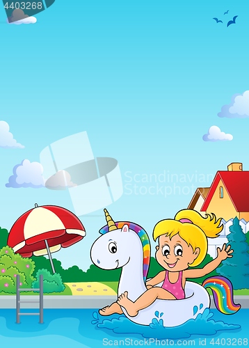 Image of Girl floating on inflatable unicorn 4