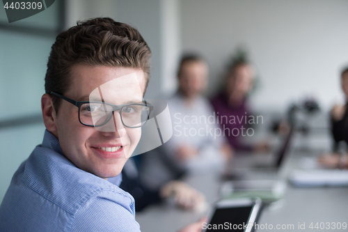 Image of Businessman using tablet in modern office