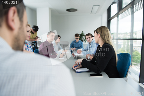 Image of Business Team At A Meeting at modern office building