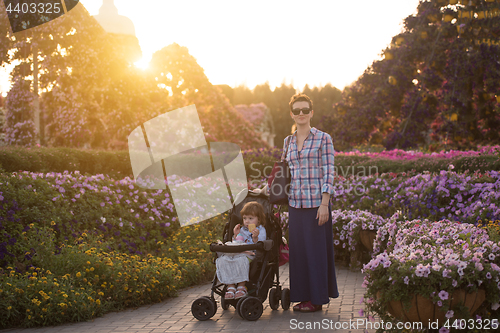 Image of mother and daughter in flower garden