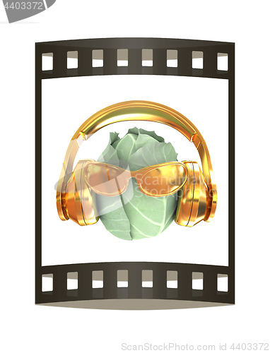 Image of Green cabbage with sun glass and headphones front \"face\" on a wh