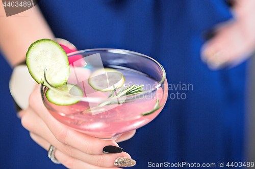 Image of The exotic cocktail and female hands