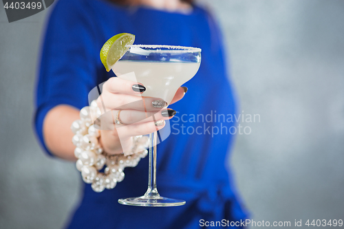 Image of The exotic cocktail and female hands