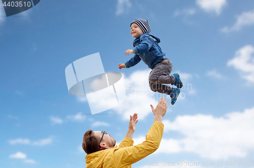 Image of father with son playing and having fun outdoors