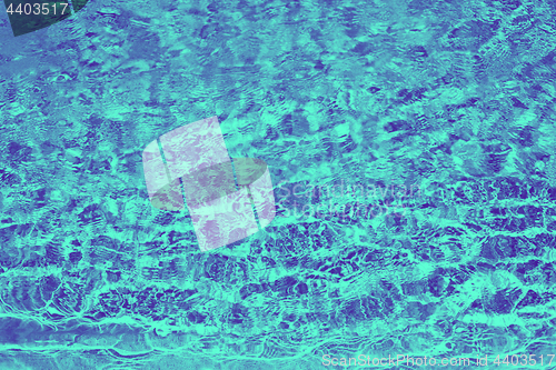 Image of ultra violet and blue duotone water in pool or sea