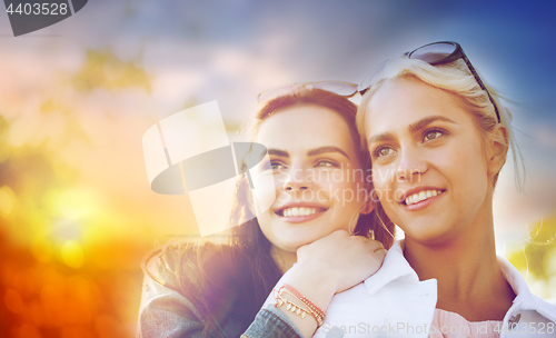 Image of happy young women or teenage girls outdoors