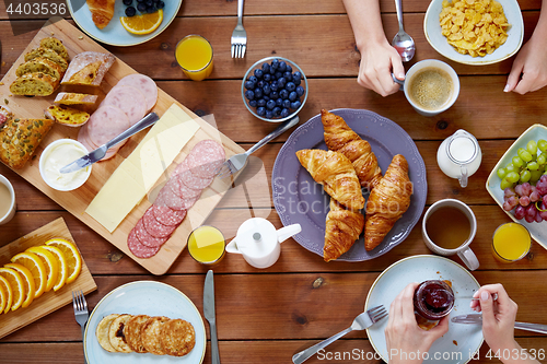 Image of group of people having breakfast at table