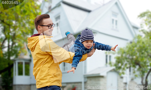 Image of father with son playing and having fun outdoors