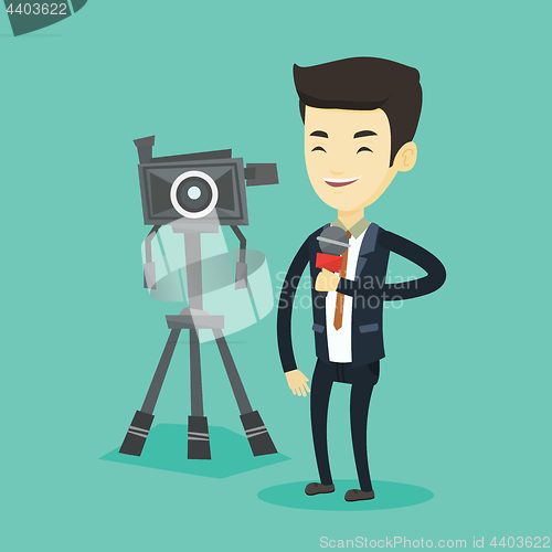 Image of TV reporter with microphone and camera.