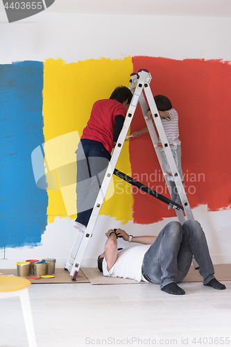 Image of boys painting wall