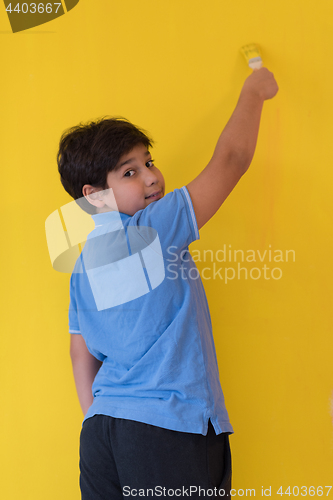 Image of Portrait of a happy young boy painter