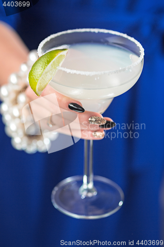 Image of The exotic cocktail and female hands