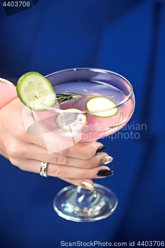 Image of The exotic cocktail and female hands