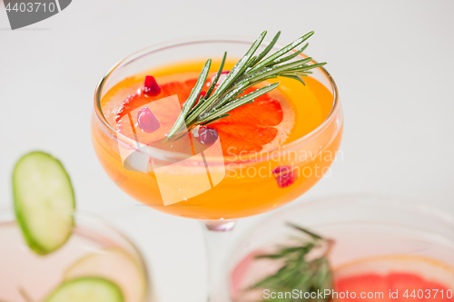 Image of The rose exotic cocktails and fruits on pink