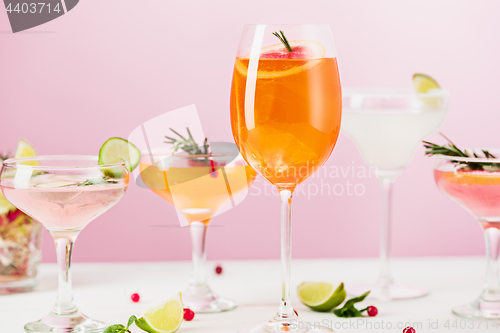 Image of The rose exotic cocktails and fruits on pink