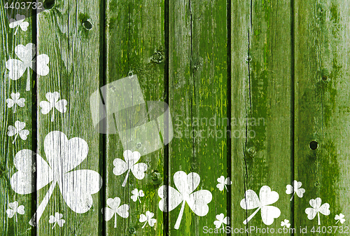 Image of shamrock pattern on old green wooden boards