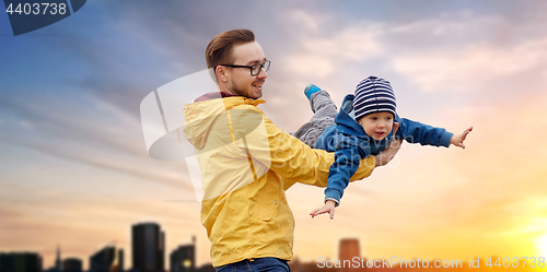 Image of father with son playing and having fun outdoors