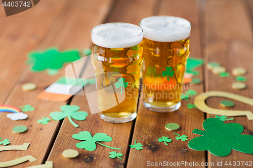 Image of glasses of beer and st patricks day decorations