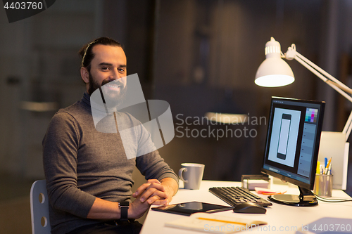 Image of creative man or designer with computer at office