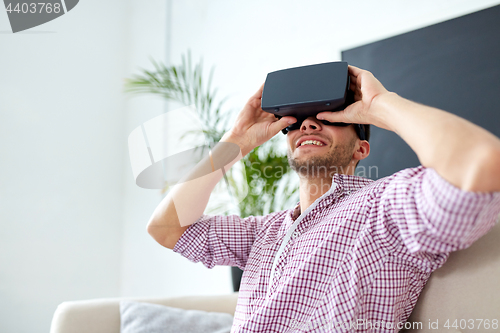 Image of happy man with virtual reality headset at office