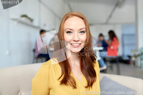 Image of happy creative female worker at office or student