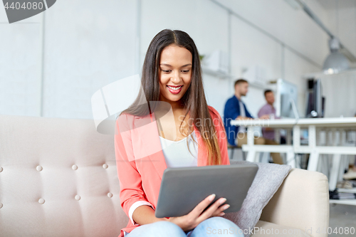 Image of african american woman with tablet pc at office