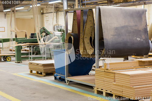 Image of wooden boards at workshop or woodworking plant