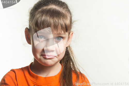 Image of Portrait of a funny emotional girl on a white background