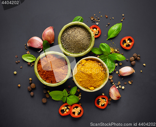 Image of various spices on black background