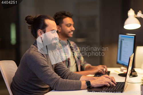 Image of creative team with computers working at office