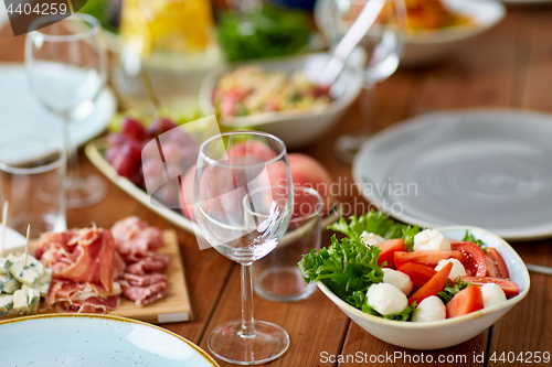 Image of vegetable salad with mozzarella on wooden table