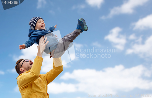 Image of father with son playing and having fun outdoors