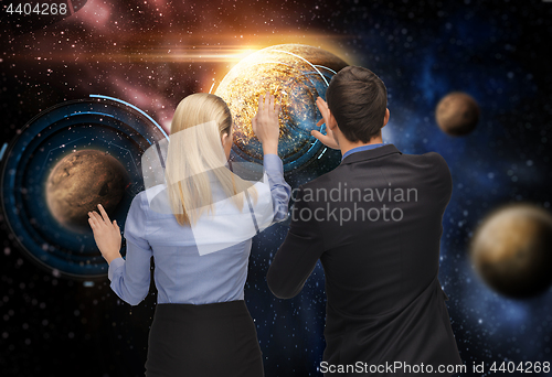 Image of businessman and businesswoman over space