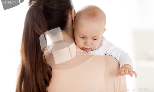 Image of close up of little baby boy with mother