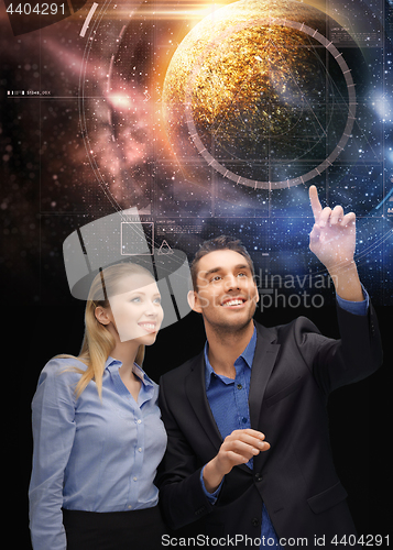 Image of businessman and businesswoman over space