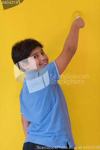 Image of Portrait of a happy young boy painter