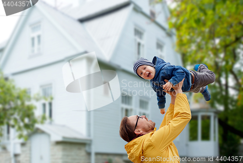 Image of father with son playing and having fun outdoors