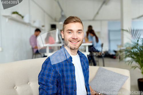 Image of happy creative male worker at office or student