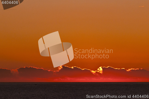 Image of Sunset landscape with ocean and clouds